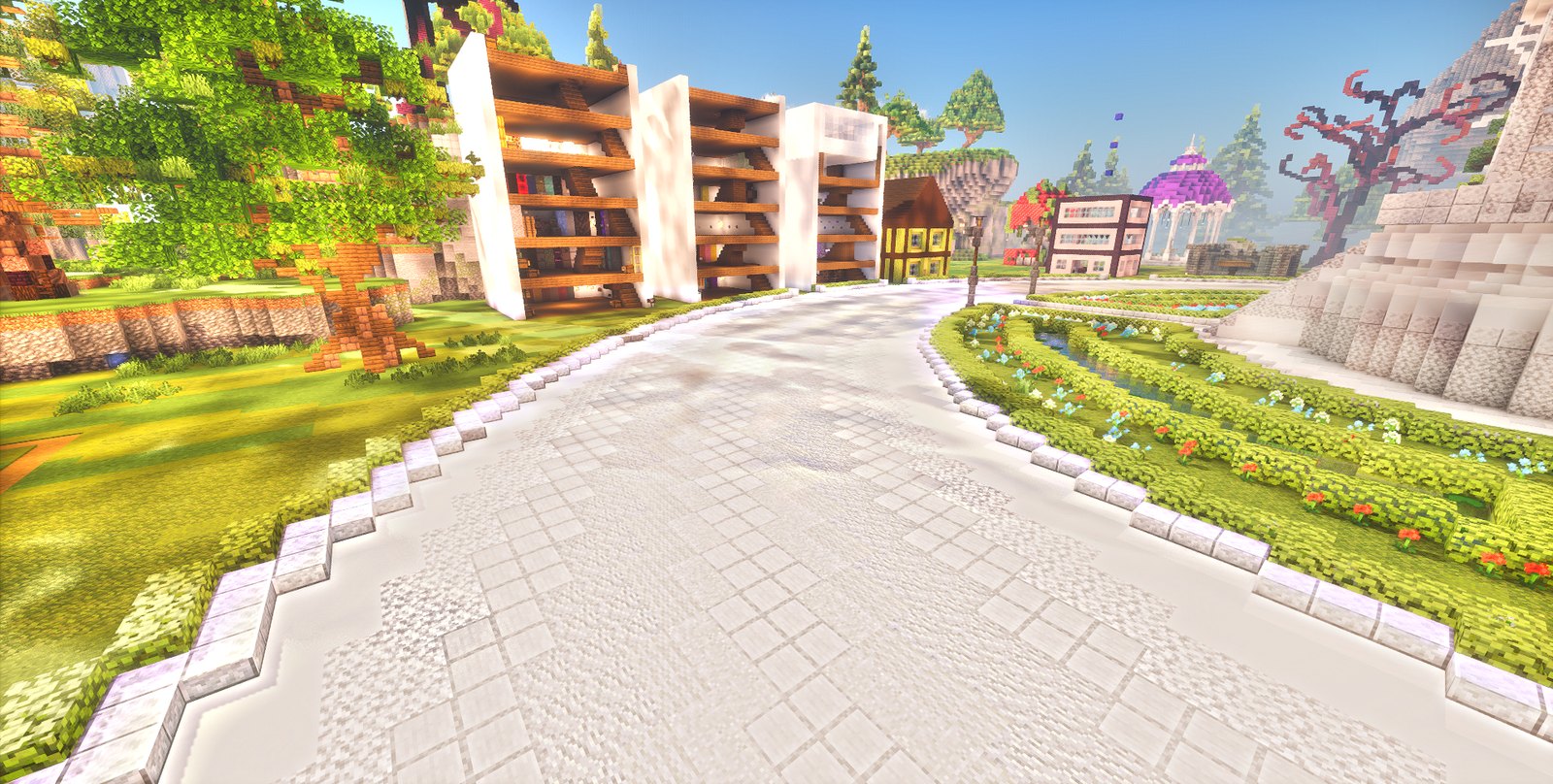 A cobbled street of player shops at spawn, lined with flower beds